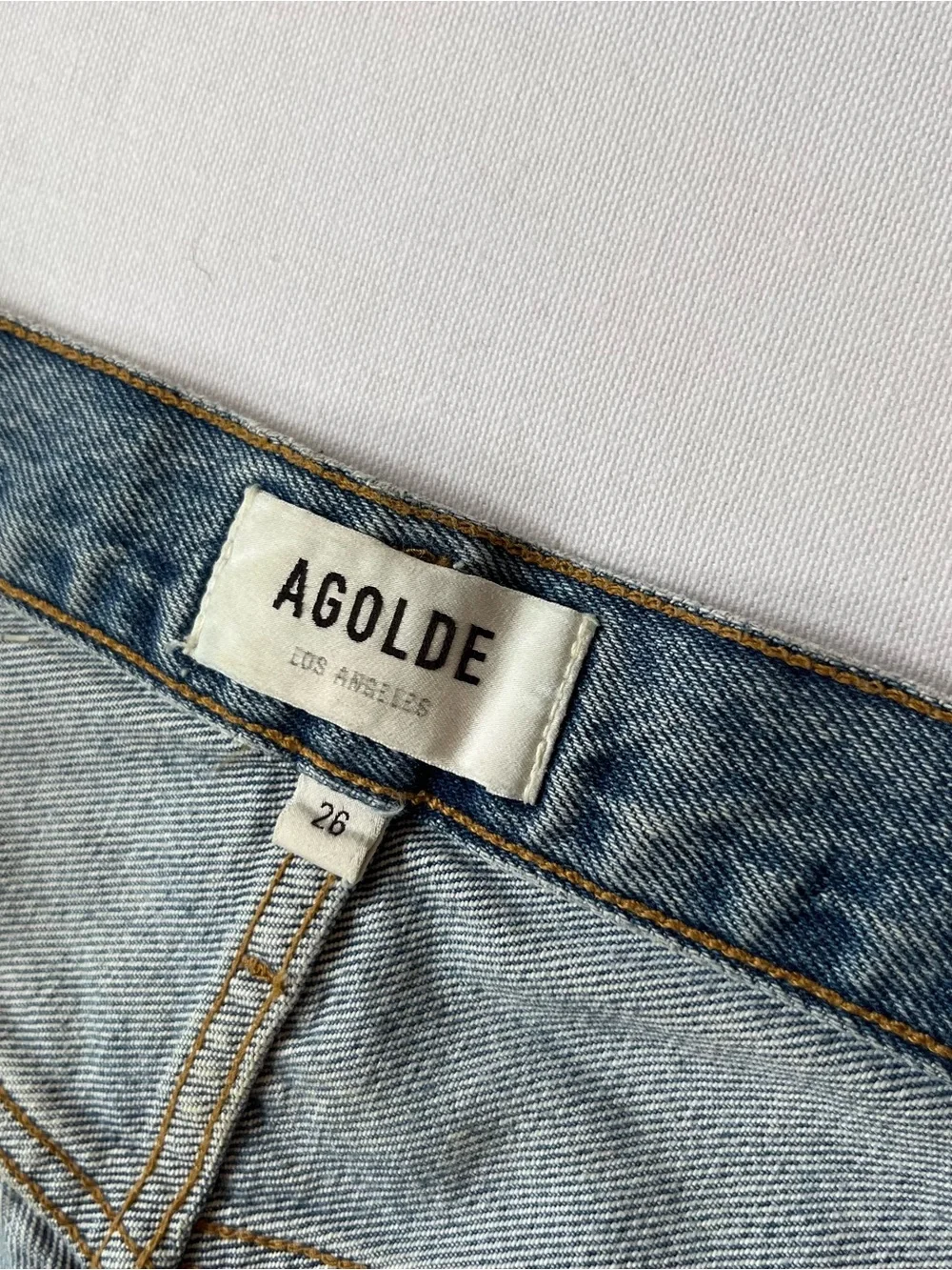 AGOLDE Riley cut off denim shorts 26 High rise Button fly Light wash Distressed